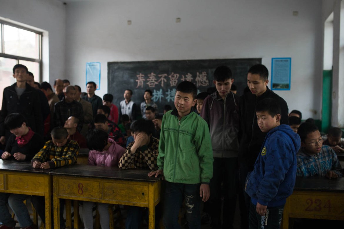 Shungze (front, in green), 16, is one of the