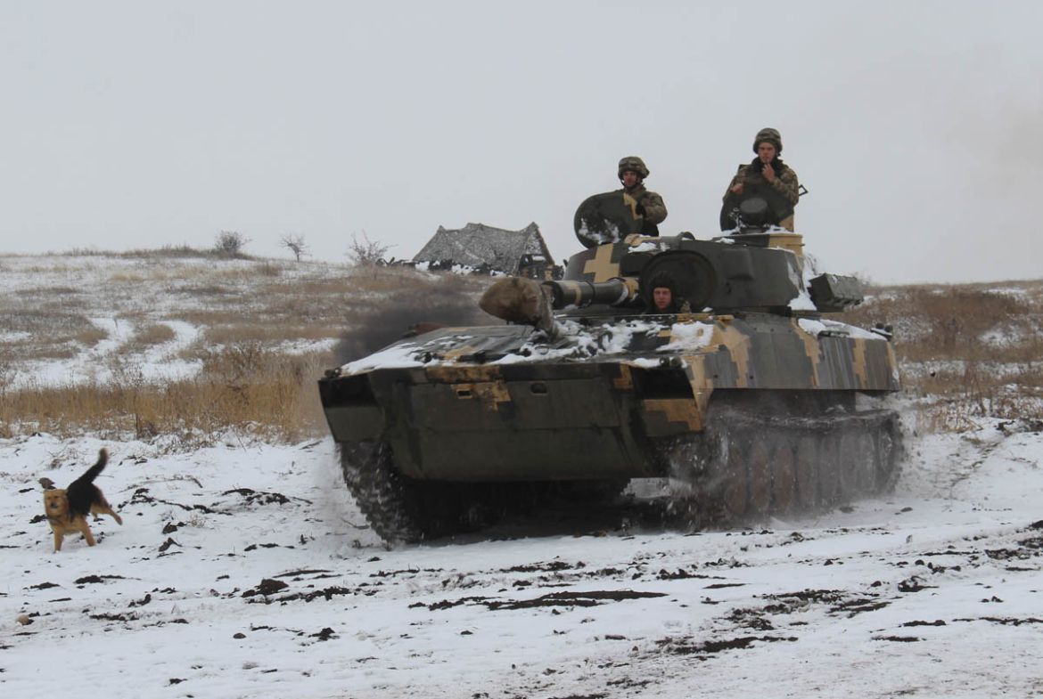 A Ukraine army APC moves toward on position at an undisclosed location in eastern Ukraine, Monday, Nov. 26, 2018. Ukrainian lawmakers were set to consider a presidential request for the introduction o