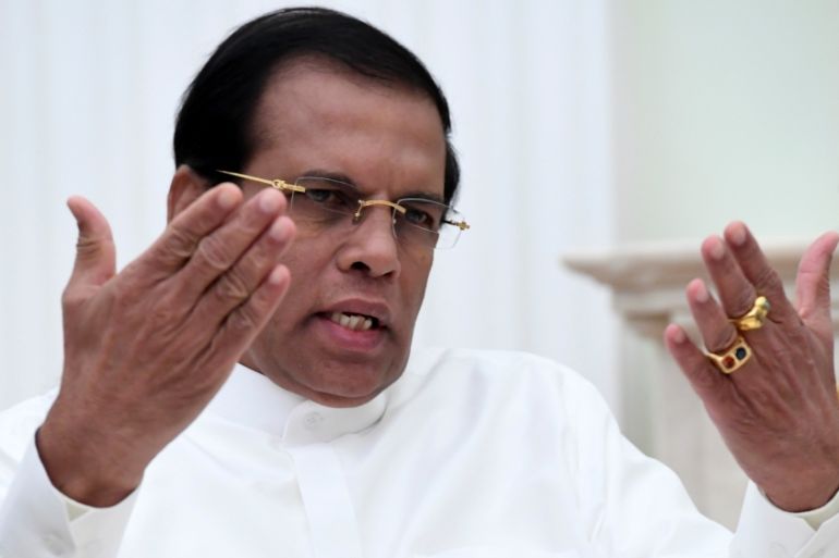 FILE PHOTO: Sri Lankan President Sirisena gestures as he speaks during meeting with his Russian counterpart Putin at Kremlin in Moscow