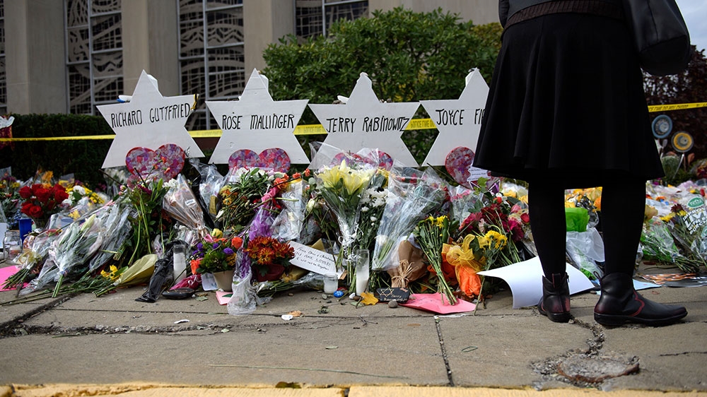 Mourners visit the memorial outside the Tree of Life Synagogue in Pittsburgh, Pennsylvania [Jeff Swensen/Getty Images/AFP]