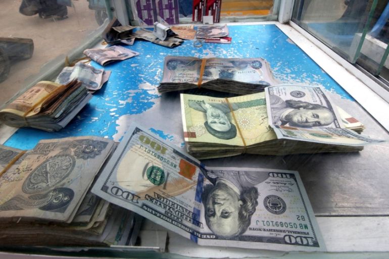 Iranian rials, U.S. dollars and Iraqi dinars are seen at a currency exchange shopÊin Basra, Iraq November 3, 2018. Picture taken November 3, 2018. REUTERS/Essam al-Sudani
