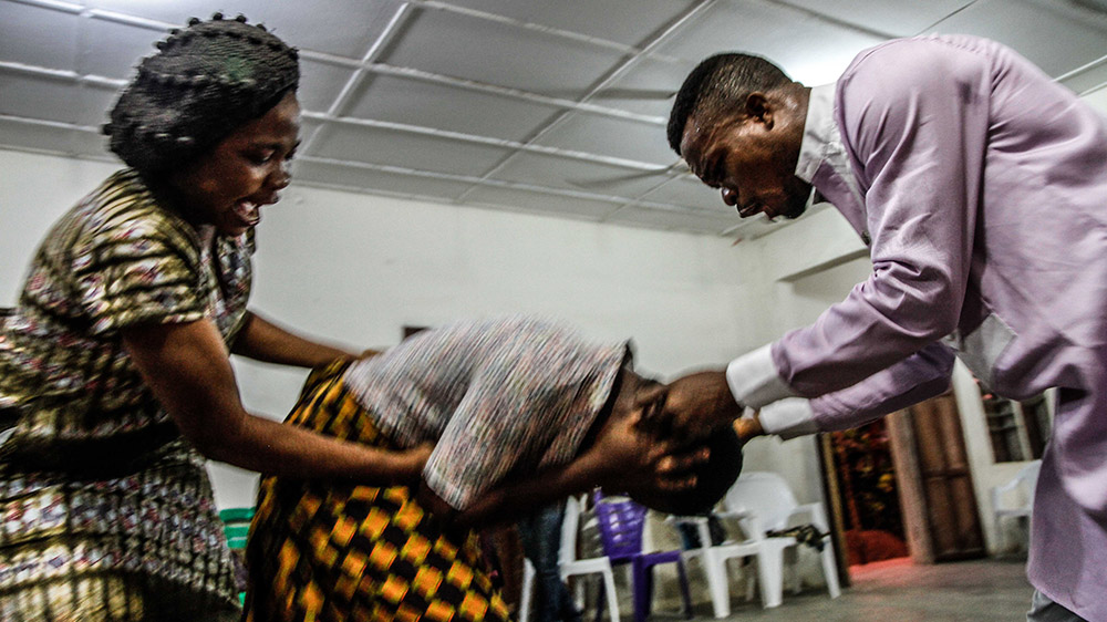 Pentecostal leaders can charge up to a year's wages - over $500 - to perform an exorcism [Marc Ellison/Al Jazeera]