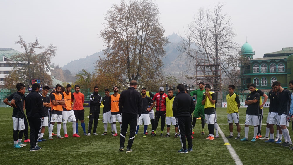 Real Kashmir FC coach David Robertson with the players during a practice session [Shuaib Bashir/Al Jazeera]