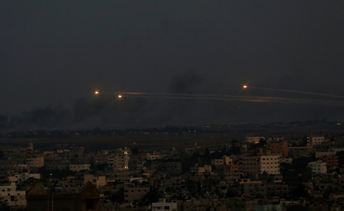 Palestinian rockets cross the sky after militants attack an Israeli bus with a mortar, in Gaza City, Monday, Nov. 12, 2018. The Israeli military said it has dispatched fighter jets to strike "terror t