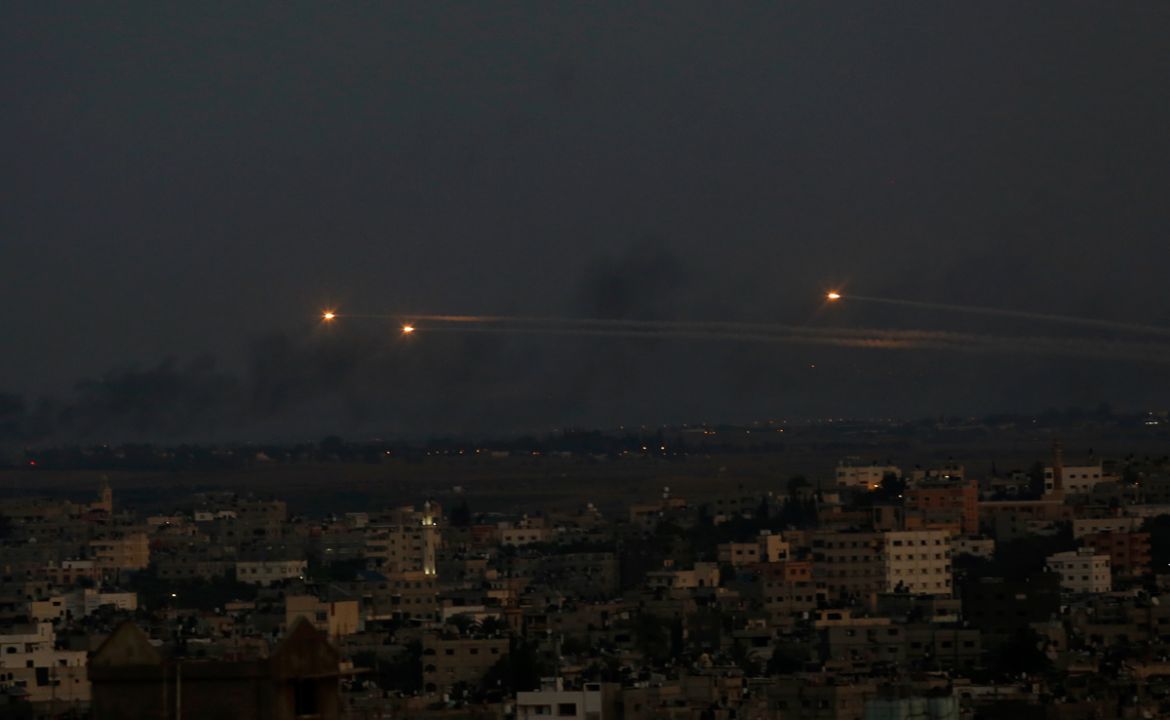 Palestinian rockets cross the sky after militants attack an Israeli bus with a mortar, in Gaza City, Monday, Nov. 12, 2018. The Israeli military said it has dispatched fighter jets to strike "terror t