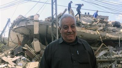 Ahmed Abu Saif: 'I expected to see my building burned to the ground one day' [Maram Humaid/Al Jazeera] 