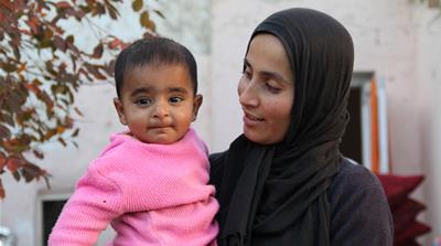 Khatera fears for the future of her daughter Zainab [Al Jazeera]