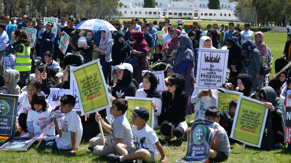 Hazara protesters hold placards during a demonstration in Canberra on Monday [Courtesy: Keyhan Farahmand]