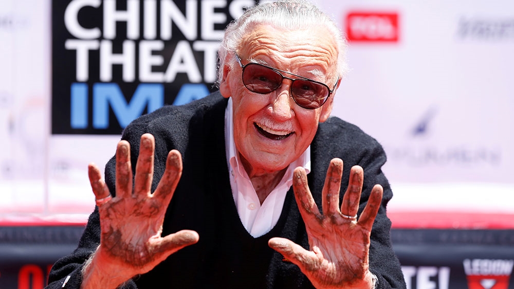 Marvel Comics co-creator Stan Lee shows his hands after placing them in cement during a ceremony in Los Angeles, California [File: Mario Anzuoni/Reuters] 