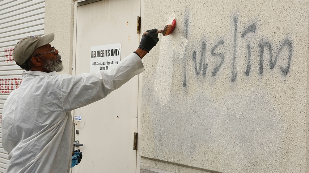 Racist graffiti is painted on the side of a mosque in Roseville, California [Rich Pedroncelli/AP Photo] 