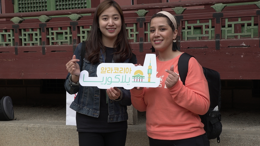 Heba with Madeeha, an Arabic-speaking representative of YallaKOREA, a Korean tourism company for Arabs who may struggle with the culture when visiting South Korea [Al Jazeera]