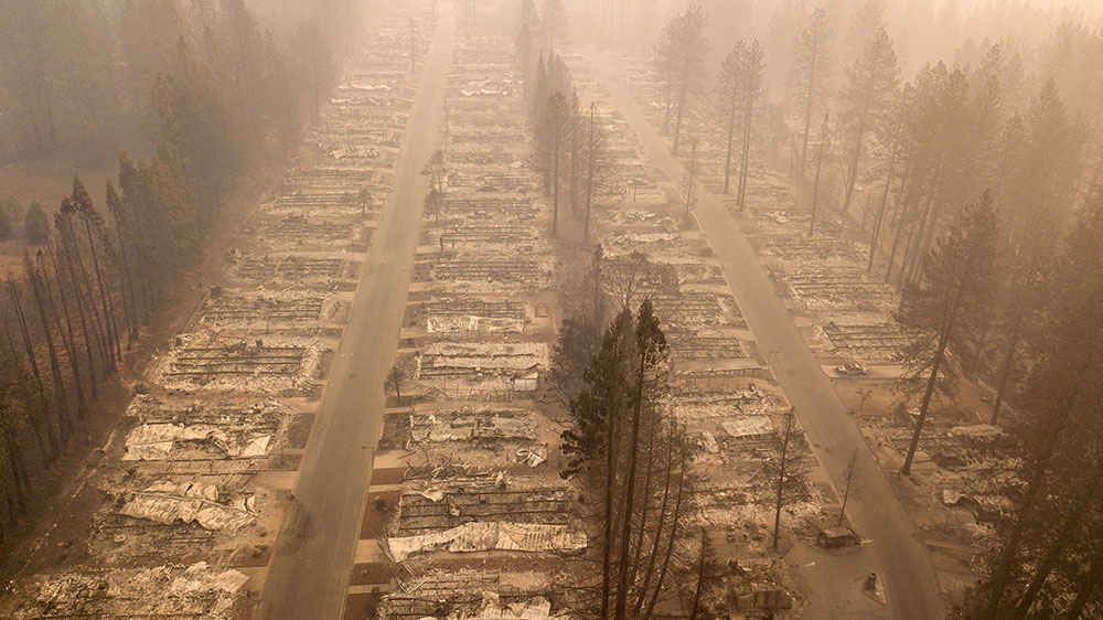 The toll in the deadliest wildfires in recent California history climbed to 81 [Josh Edelson/AFP]
