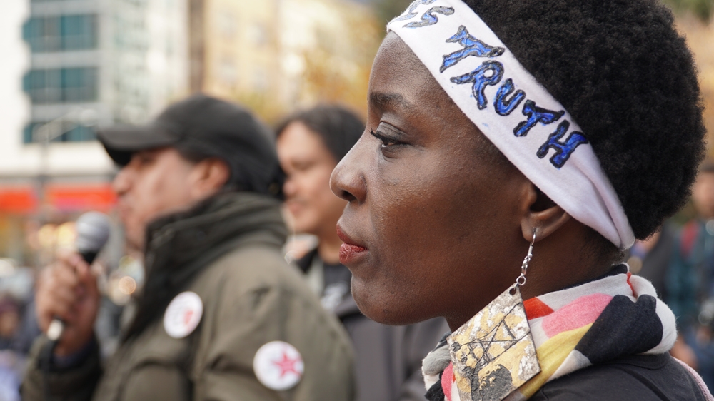 
Patricia Okoumou, the activist who climbed the Statue of Liberty, at the protest on Saturday [Azad Essa/Al Jazeera]
