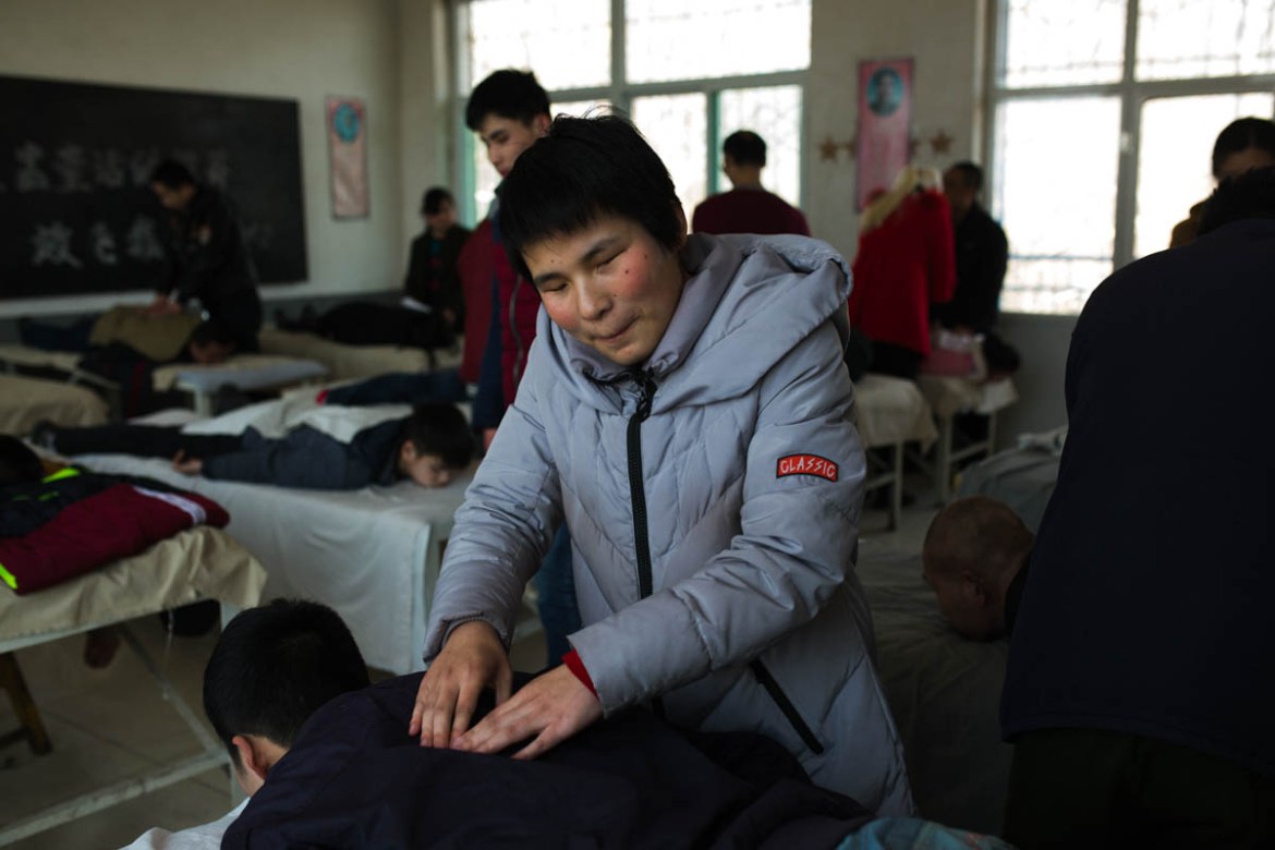 Older students receive vocational training in massage, one of the very few employment opportunities available to visually impaired people in China.
