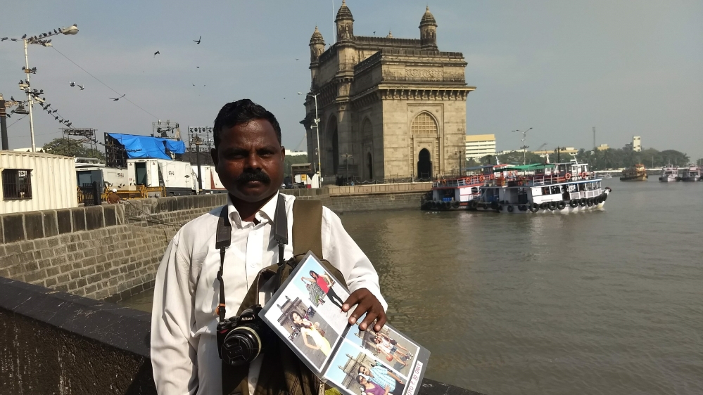 Choudhary has been working outside Taj Mahal Palace Hotel and Gateway of India for 20 years [Priyanka Borpujari/Al Jazeera]
