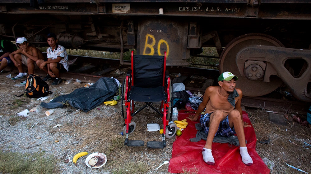 Sergio Caceres rests beside his wheelchair in Arriaga, Mexico [Rebecca Blackwell/AP Photo]
