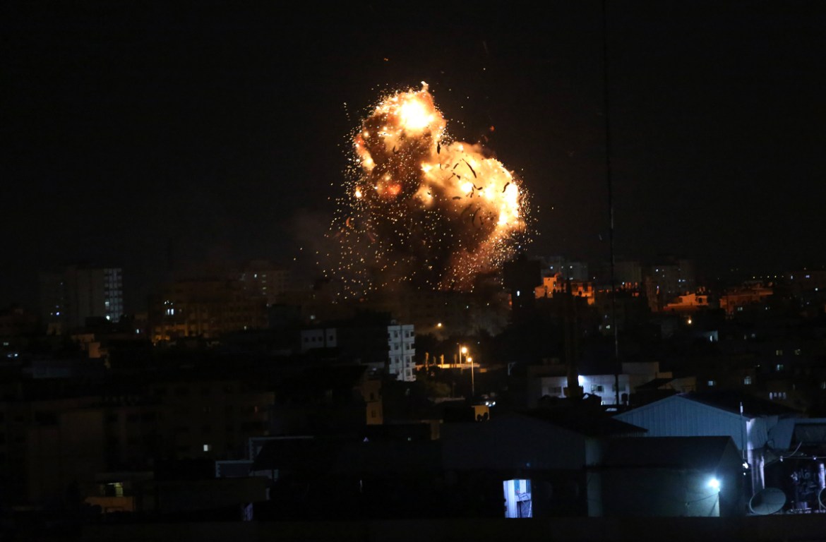 An explosion caused by Israeli airstrikes on the building of Hamas'' Al-Aqsa TV station in Gaza City, Monday, Nov. 12, 2018. Palestinian militants on Monday fired dozens of rockets and mortar shells in