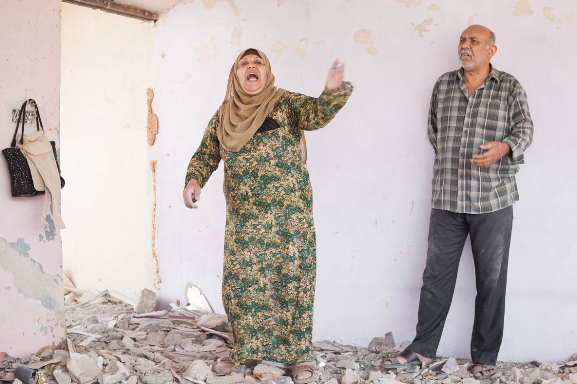 Ghania Ghanim Mohammed, the mother of nine children, loses her temper while denouncing a lack of government support in term of reconstruction. “