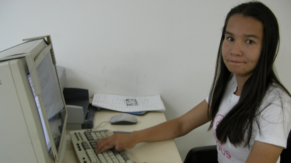 Linda Lopez works in her foundation's office in 2005 [Jen Ross/Al Jazeera] 