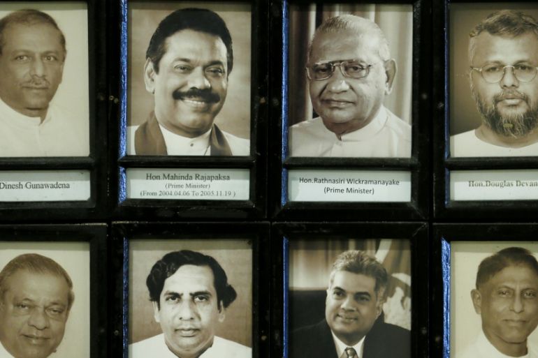 Images of Lawmakers, including newly appointed Prime Minister Rajapaksa and sacked Prime Minister Wickremesinghe are seen at the parliament in Colombo