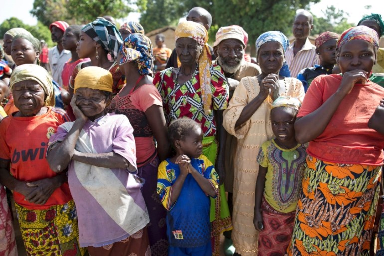 Women stand in line for food aid distribution delivered by the United Nations Office for the Coordination of Humanitarian Affairs and world food program in the village of Makunzi Wali, Central African