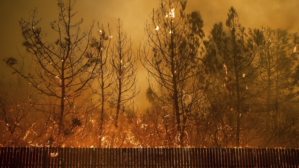 Tens of thousands of people fled a fast-moving wildfire Thursday in Northern California [Noah Berger/AP Photo]