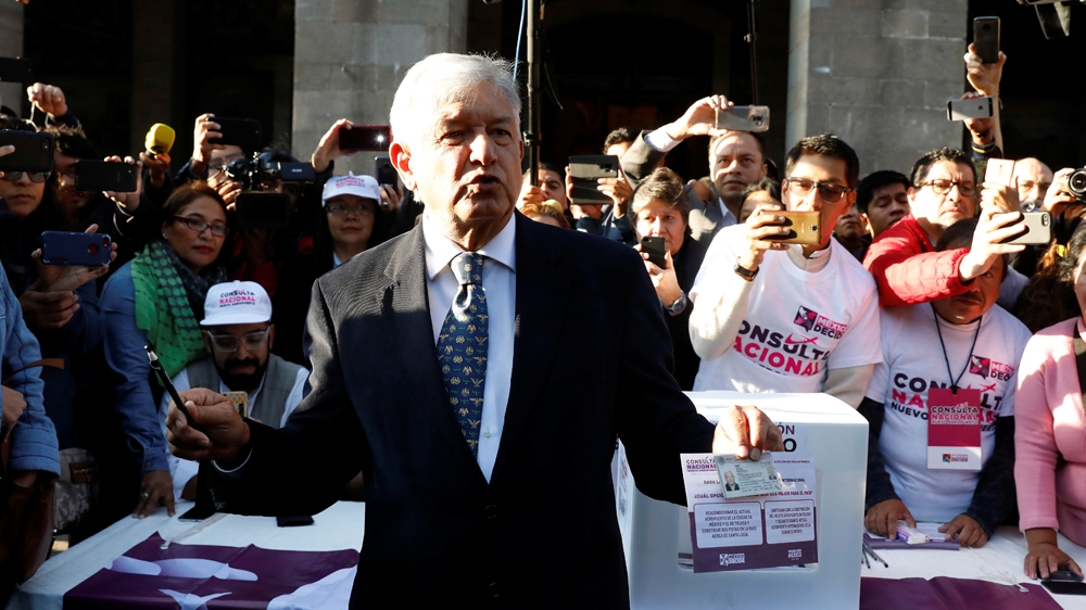 Obrador cast his vote on a referendum on the $13.3bn Mexico City International Airport project [Andres Stapff/Reuters]