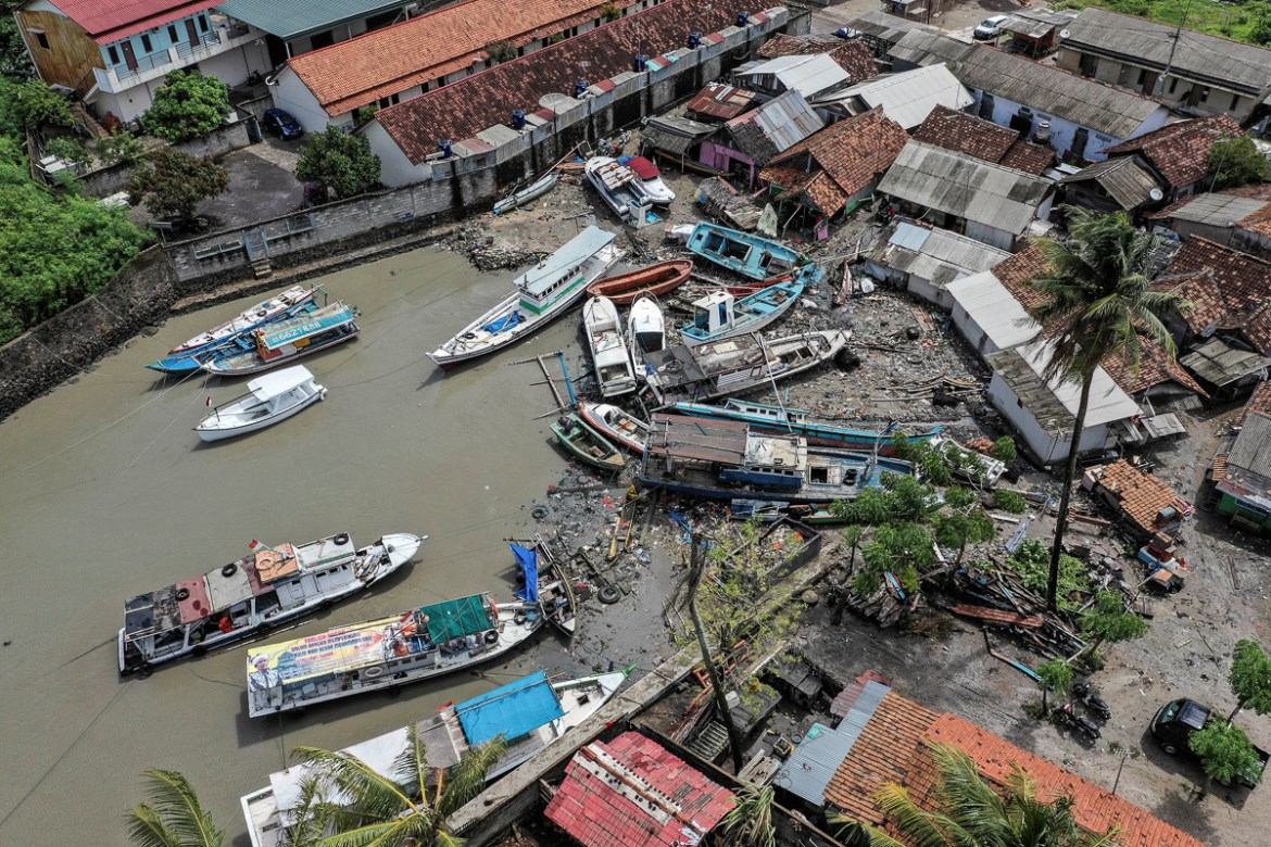 Stranded boats are seen near houses after a tsunami hit at Anyer in Banten, Indonesia, December 24, 2018 in this photo taken by Antara Foto. Antara Foto/Muhammad Adimaja/ via REUTERS