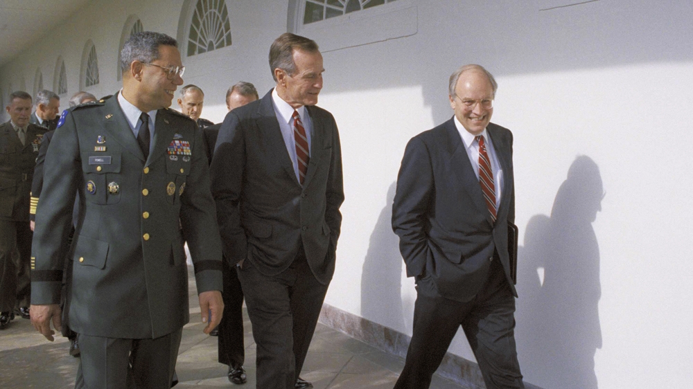 George HW Bush, his Defence Secretary Dick Cheney, and Joint Chiefs Chairman General Colin Powell in January 1992 celebrated the first anniversary of the start of Operation Desert Storm [File: Dennis Cook/AP]