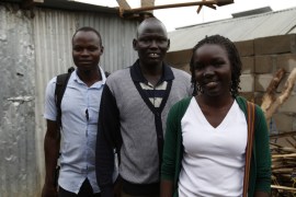 Ray Okech (left) and Maura Ajak posing with the character Kim Bany from their short VR film “Living With Disability” in South Sudan.