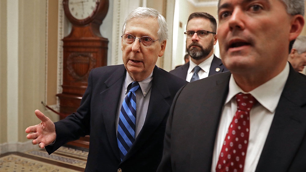 Senate Majority Leader Mitch McConnell (R-KY) (L) and Sen. Cory Gardner (R-CO) head to the floor to vote to begin debate on a bipartisan criminal reform bill [Chip Somodevilla/Getty Images/AFP] [Daylife]