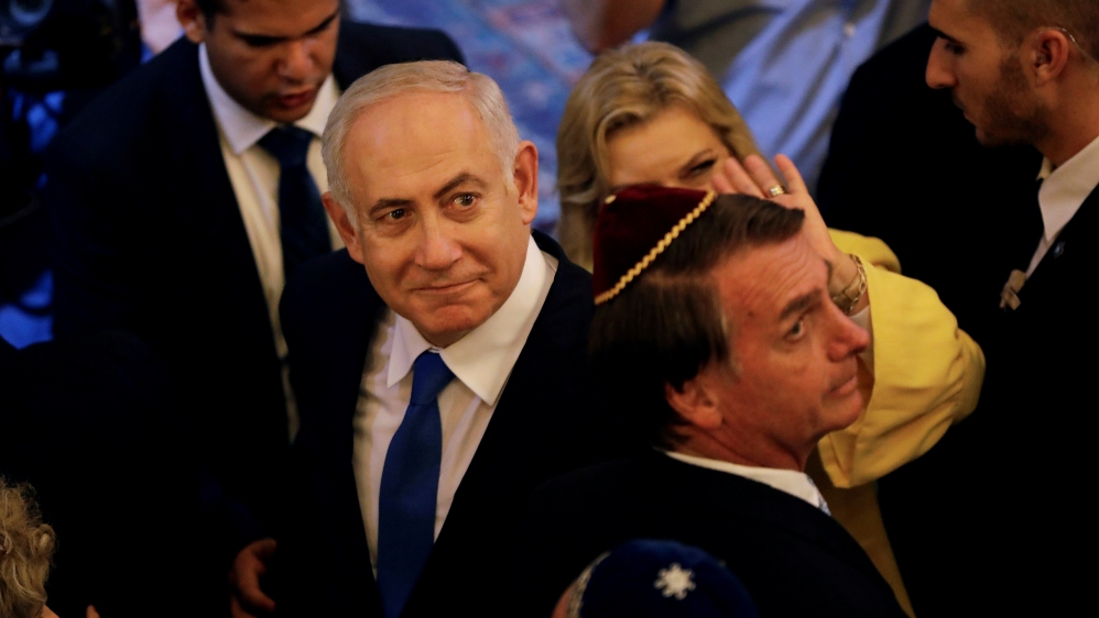 Bolsonaro (right) and Netanyahu (left) visited a synagogue in Rio de Janeiro [Leo Correa/Pool via Reuters]