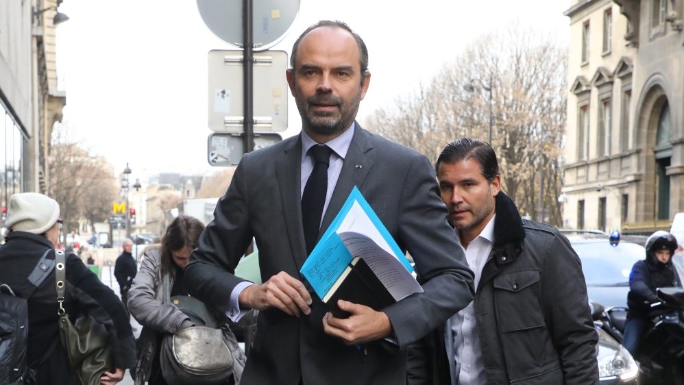 French Prime Minister Edouard Philippe announce the suspension on rising fuel taxes on December 4 [Ludovic Marin/ AFP]