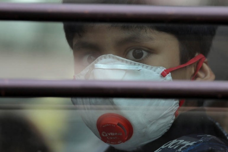 Schoolboy wearing a protective mask
