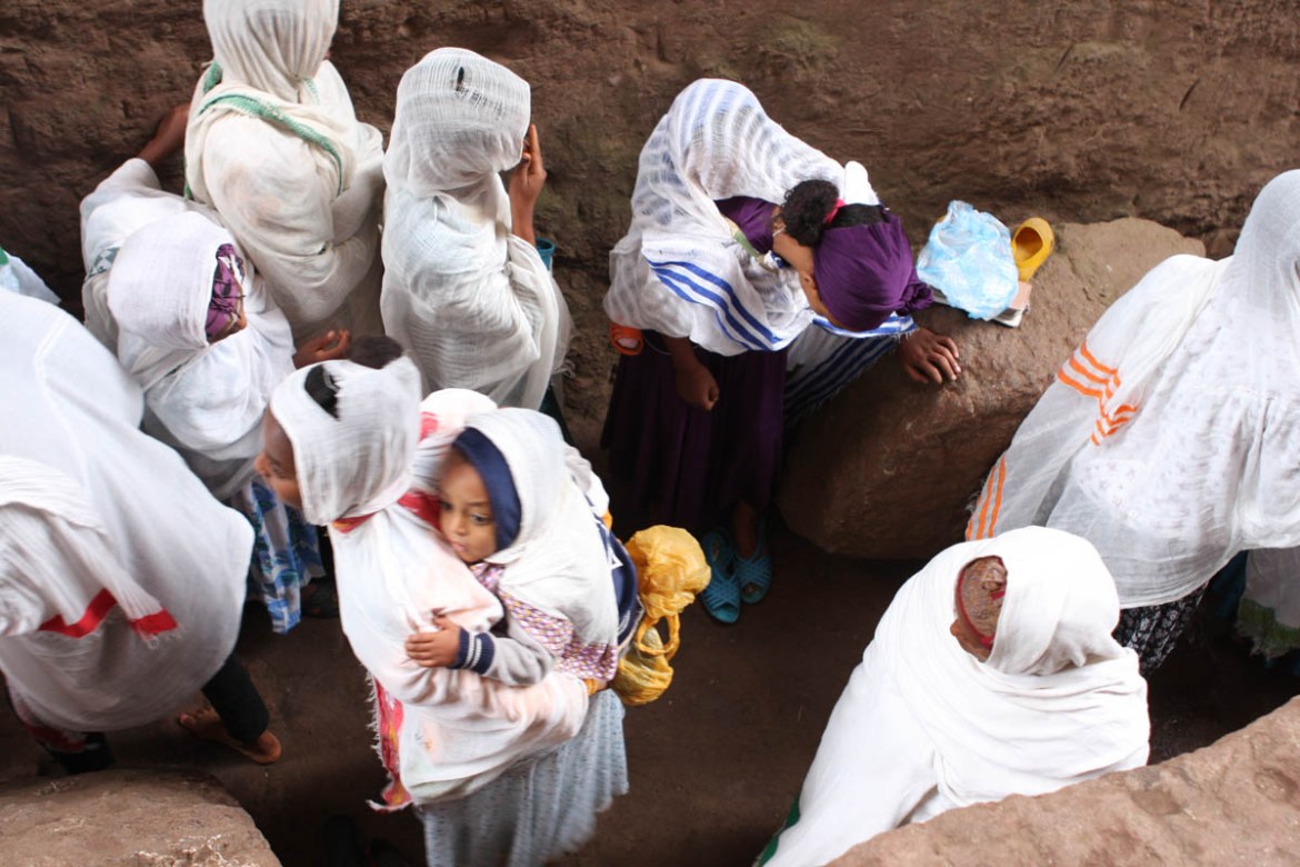 Worshippers moving along one of the trenches cut out in the church complex, early in the morning. Recent restoration work is one of a number of concerns the Lalibela Mission team has about how conserv