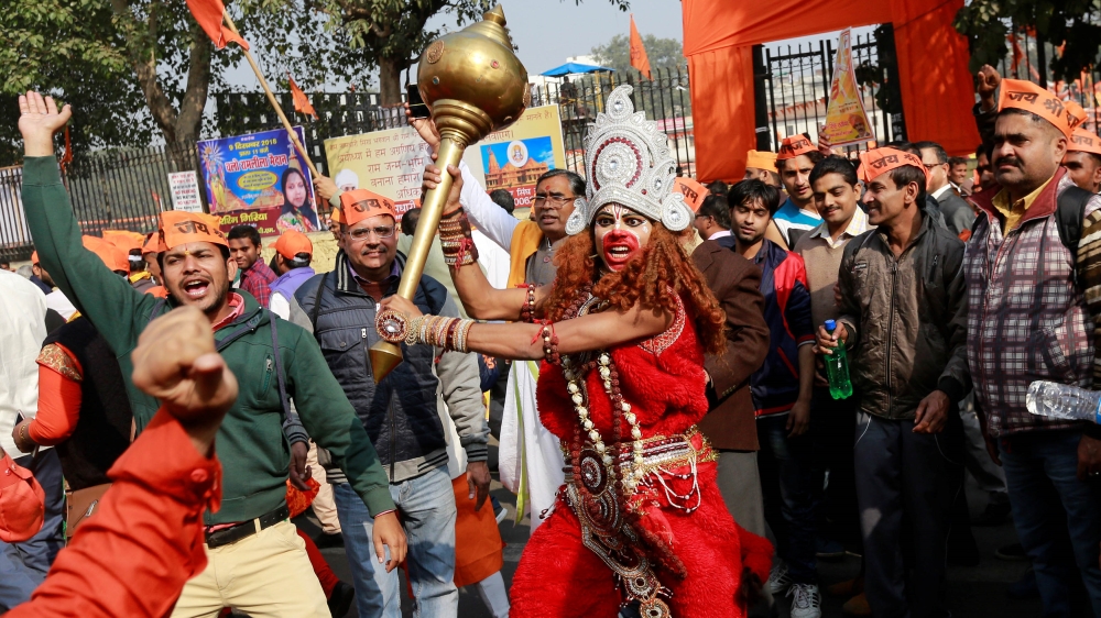 A VHP supporter dressed as Hindu monkey god Hanuman at the protest meeting [Adnan Abidi/Reuters]