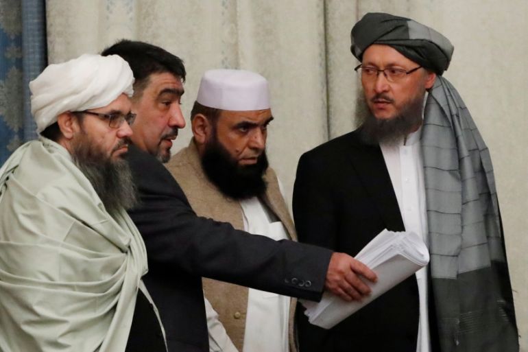 Members of Taliban delegation take their seats during the multilateral peace talks on Afghanistan in Moscow