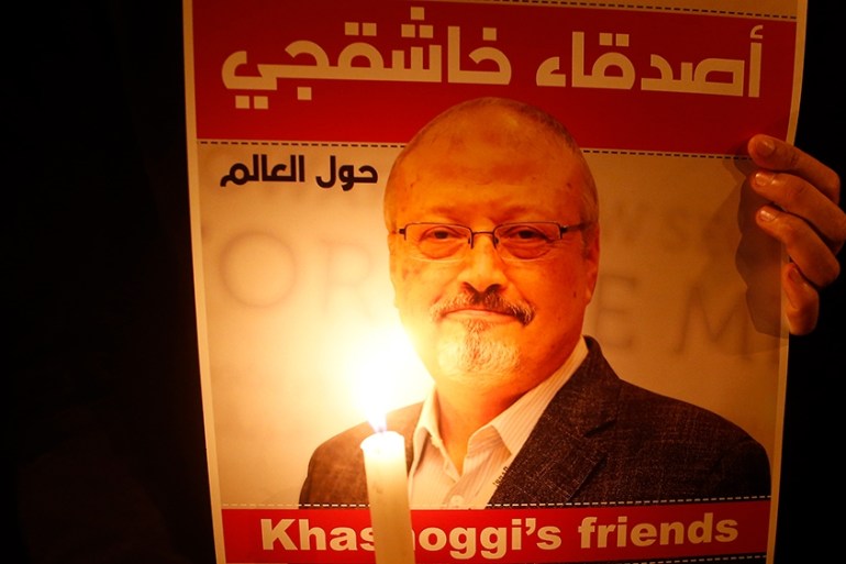 Activists, protesting the killing of Saudi journalist Jamal Khashoggi, hold a candlelight vigil outside Saudi Arabia''s consulate in Istanbul, Thursday, Oct. 25, 2018. The poster reads in Arabic:'' Khas