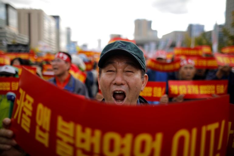 FILE PHOTO: A taxi driver takes part in a protest against a carpool service application, in Seoul