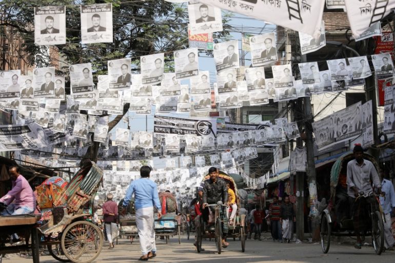 Posters are seen hanging on the street as part of the election campaign, ahead of the 11th general election in Dhaka
