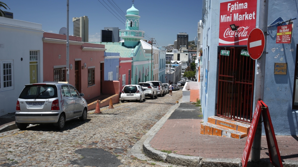 A brightly painted mosque is pictured in the neighbourhood of Bo Kaap [Erica Jenkin/Al Jazeera]