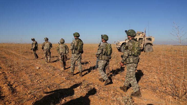 U.S. and Turkish soldiers patrol Manbij