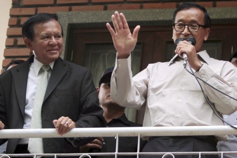 President of National Rescue Party Sam Rainsy, right, gives a speech as his party''s Vice President Kem Sokha, left,