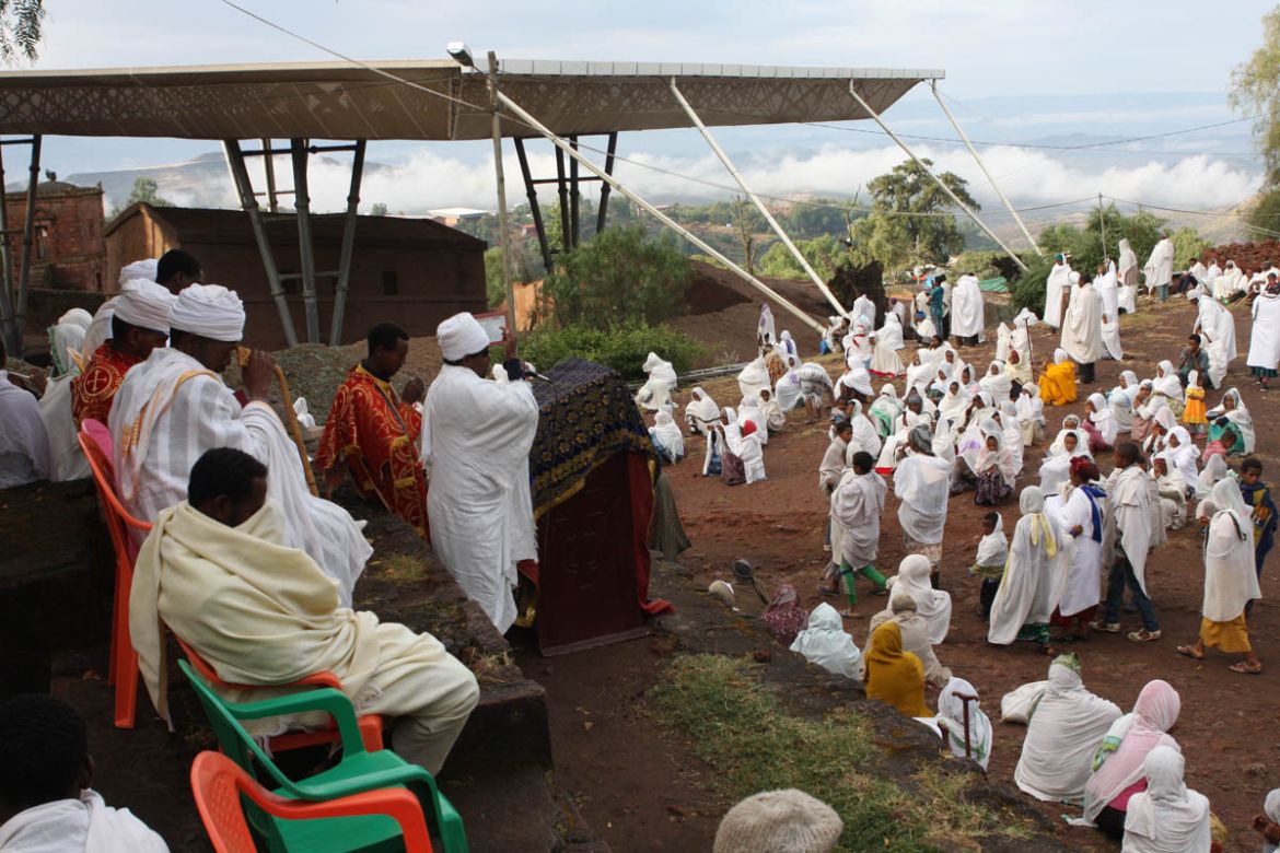 Early in the morning worshippers gather on the ground above Bet Medhane Alem church to listen to a priest. Ethiopia has one of the world’s oldest Christian traditions, stretching back to the 4th centu