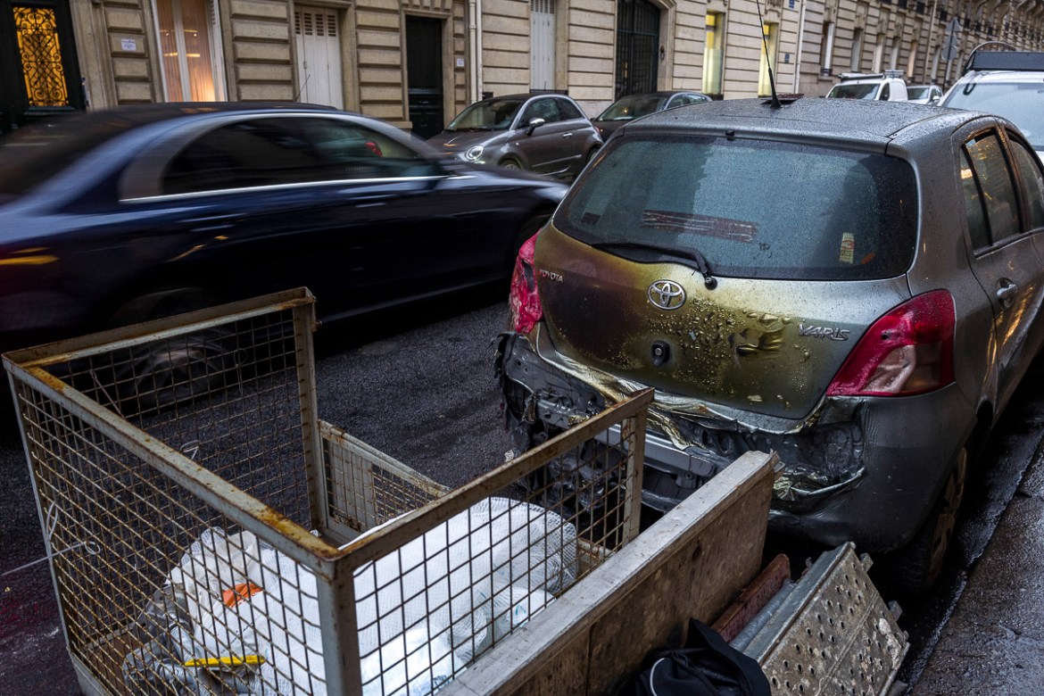 The trunk of a car is seen melted on a street where a diplomatic car was set on fire during last Saturdayi´s protests near the Champs ElysE`es on December 03, 2018 in Paris, France. While the final co