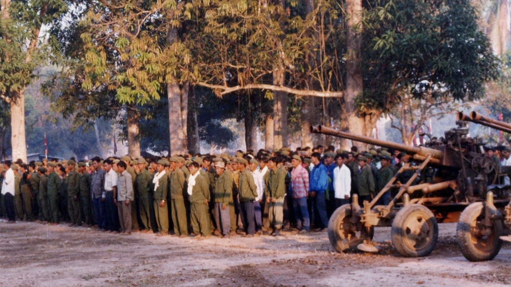 Khmer Rouge soldiers line up before changing into government army fatigues in Anlong Veng [Courtesy Documentation Center of Cambodia/Al Jazeera]