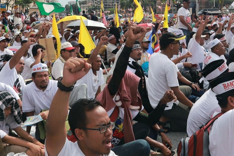 People take part in an Anti-ICERD mass rally in Kuala Lumpur