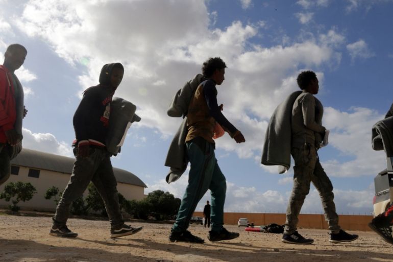 Migrants walk at a detention centre run by the Interior Ministry of Libya''s eastern-based government, in Benghazi