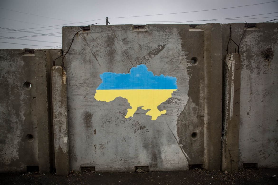 The map of Ukraine before 2014 painted on a separation wall at the checkpoint between government and non-government-controlled areas in Stanystia Luhanska in eastern Ukraine. Photo: Ingebjørg Kårstad/