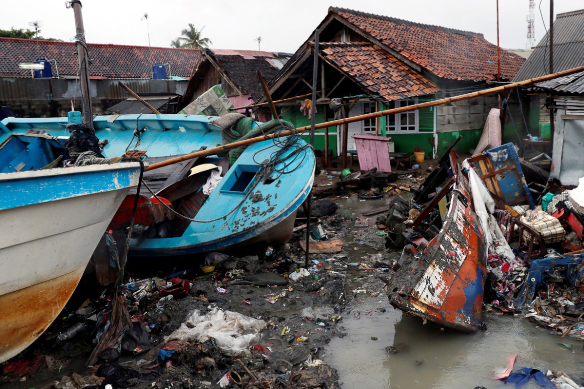 Vessels are washed up next to houses after a tsunami hit, in Anyer, Banten province, Indonesia December 25, 2018. REUTERS/Jorge Silva